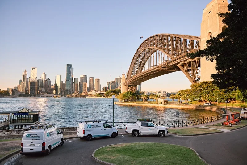 AB Electricians van against the North Sydney skyline